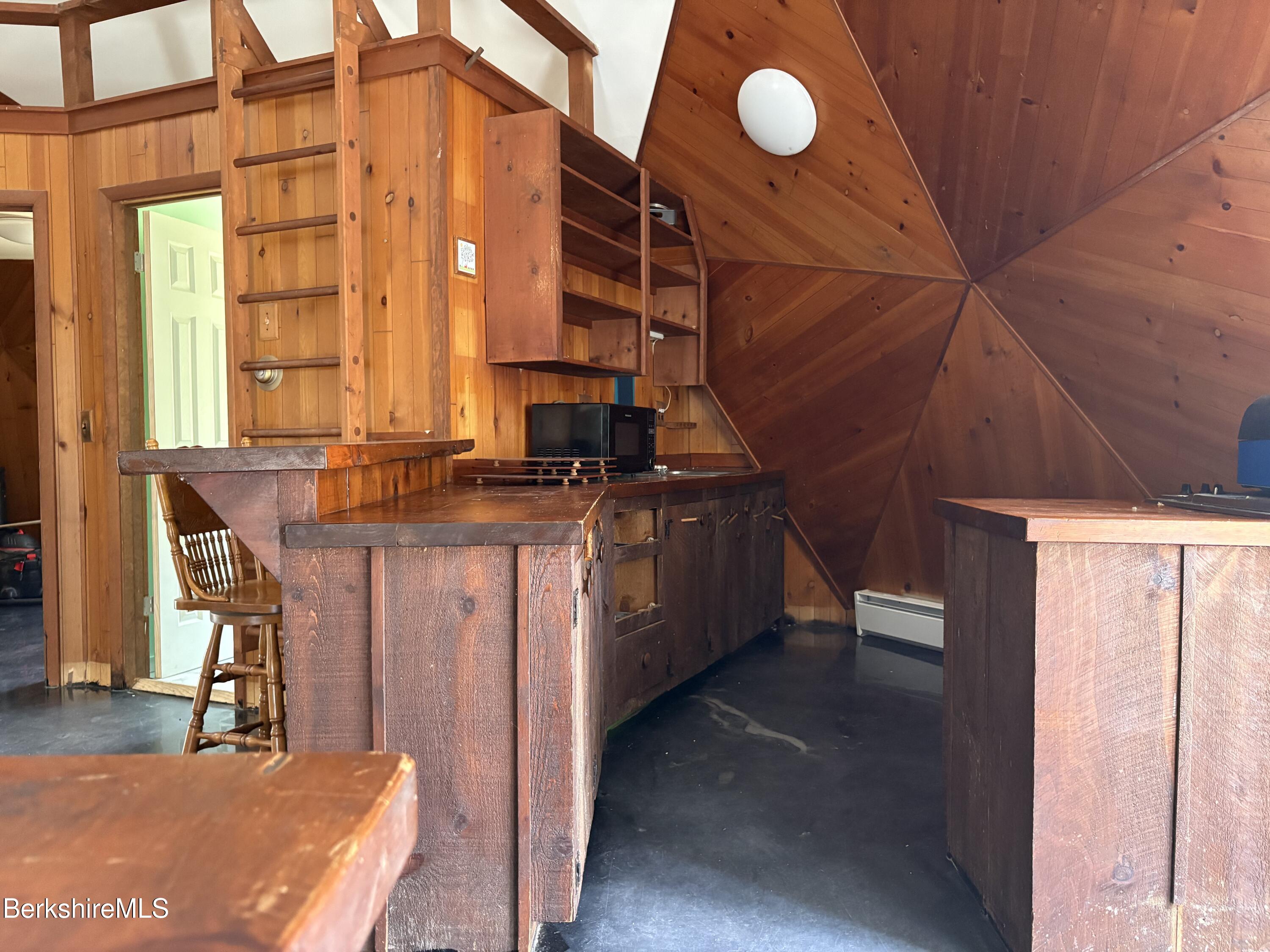 2110 West Center Road Otis, MA 01253 - Photo 13 of 24 a view of a kitchen with furniture and windows