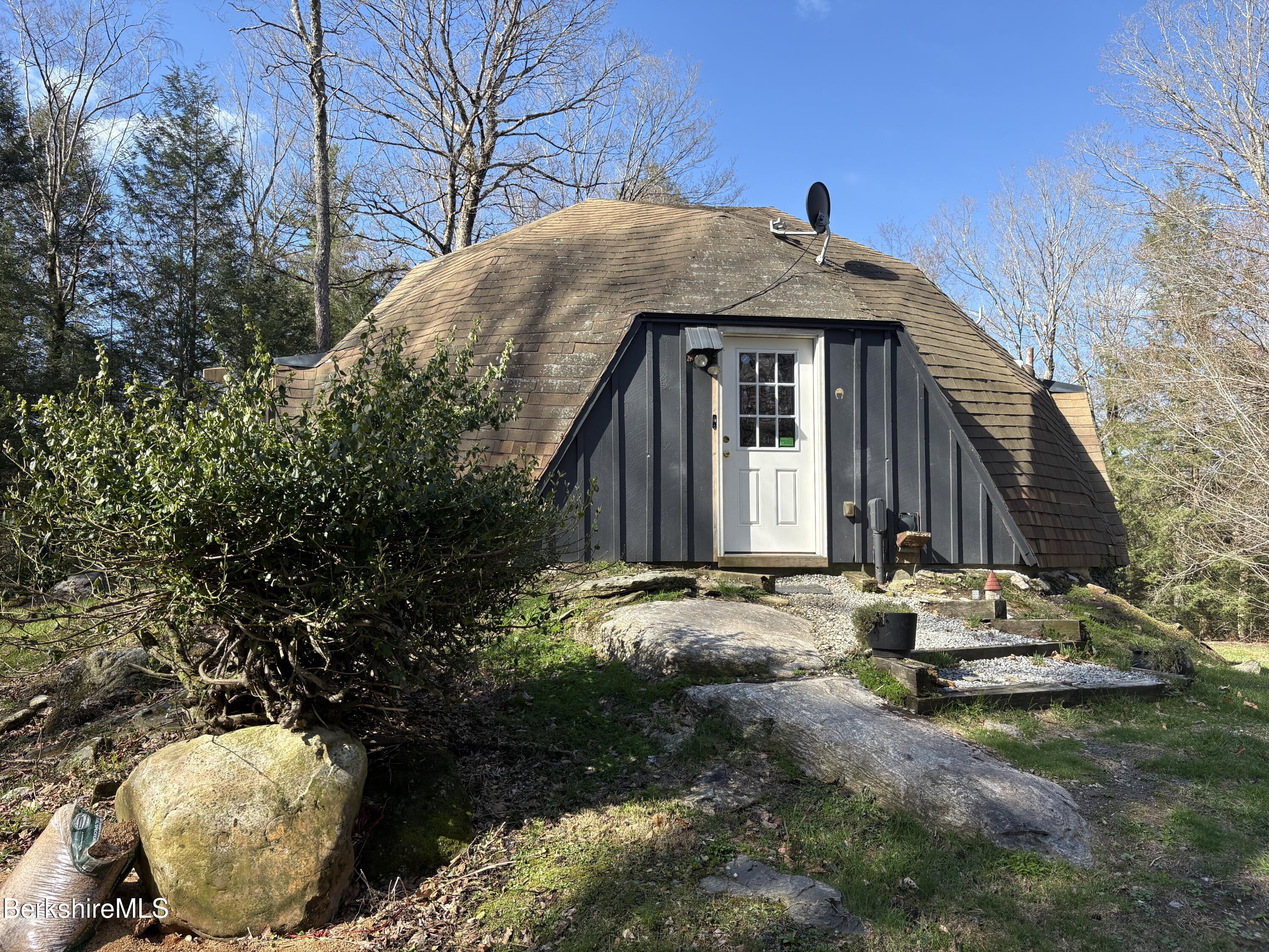 2110 West Center Road Otis, MA 01253 - Photo 2 of 24 a front view of a house with yard