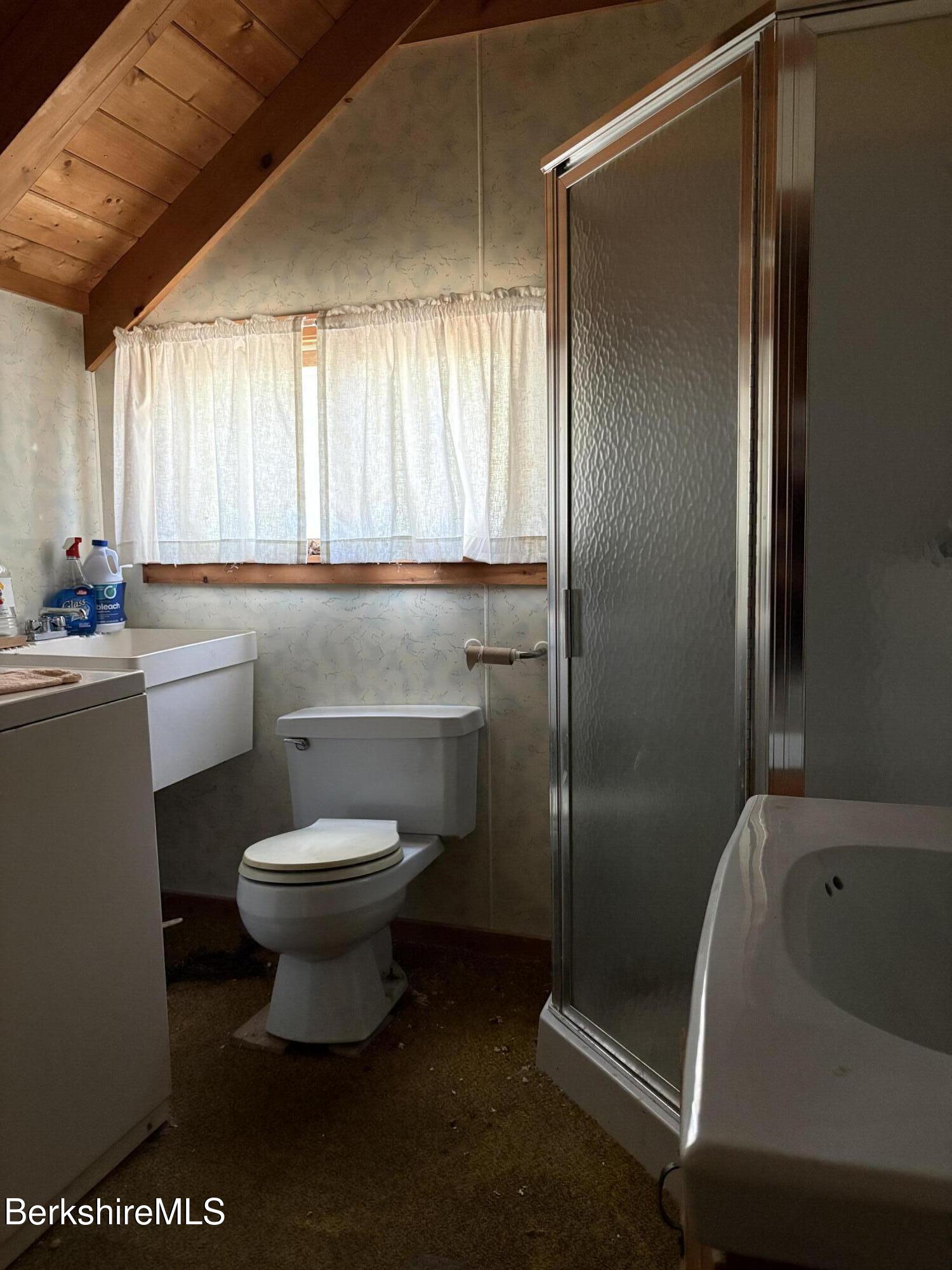 2110 West Center Road Otis, MA 01253 - Photo 23 of 24 a bathroom with a sink toilet and shower