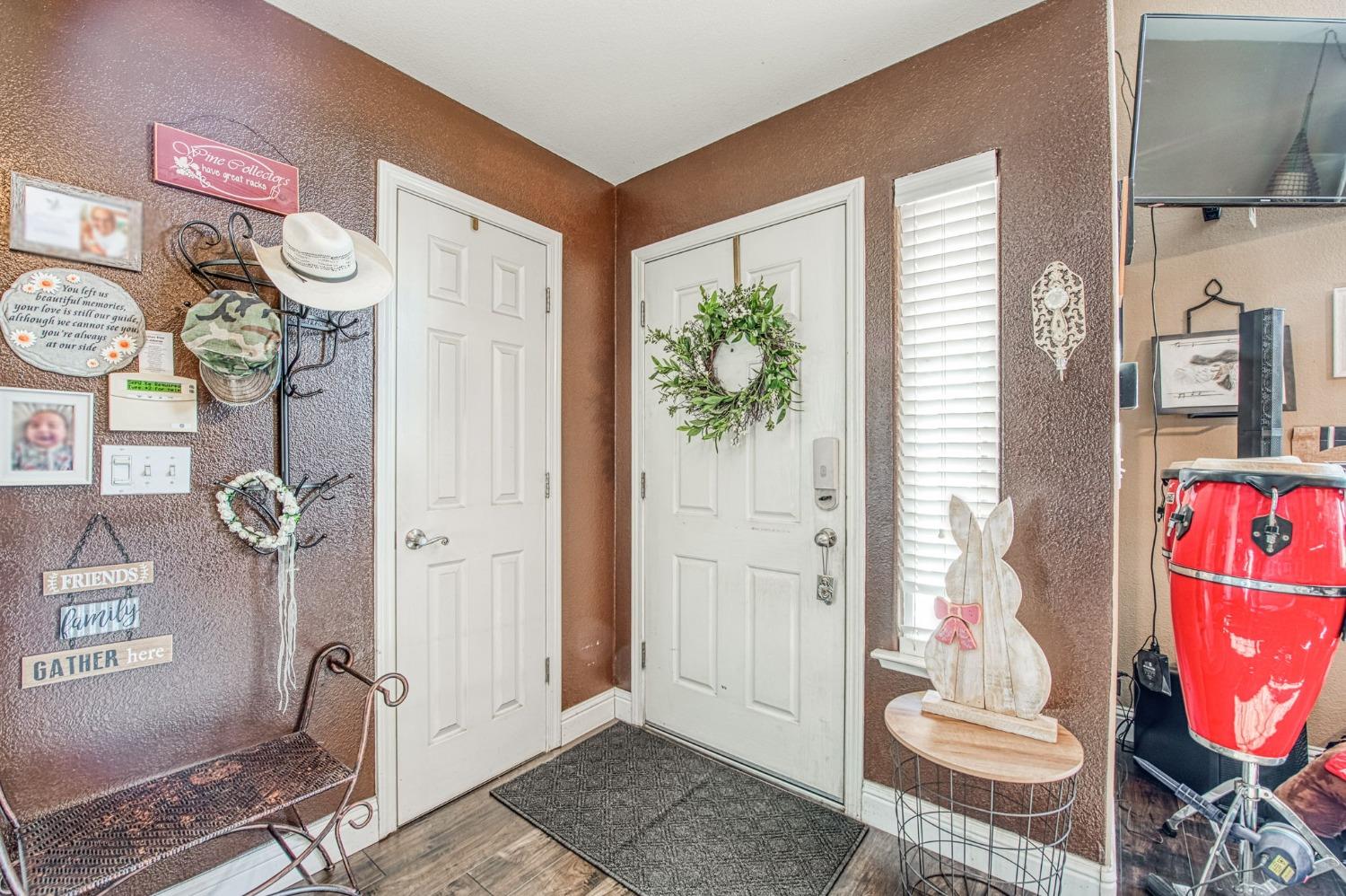 901 Maple Street Parlier, CA 93648 - Photo 2 of 67 a bathroom with a granite countertop sink and a mirror