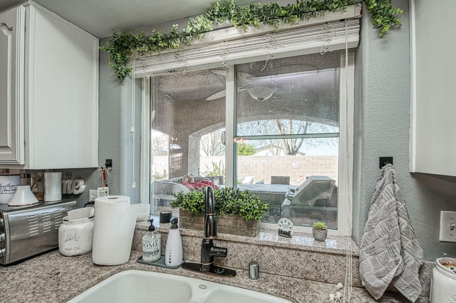 901 Maple Street Parlier, CA 93648 - Photo 21 of 67 a room with a glass door and glass door