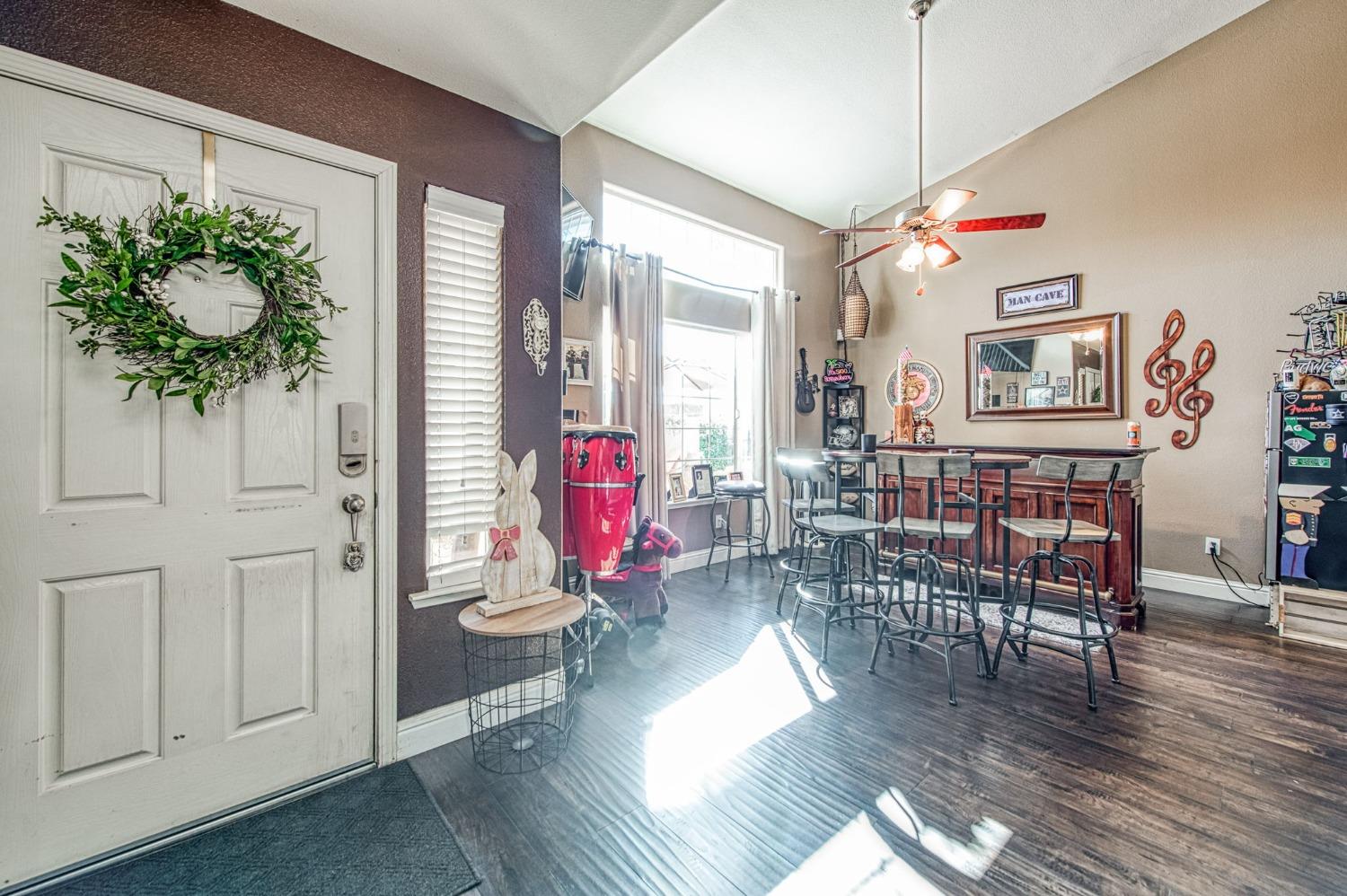 901 Maple Street Parlier, CA 93648 - Photo 4 of 67 a living room with furniture and wooden floor