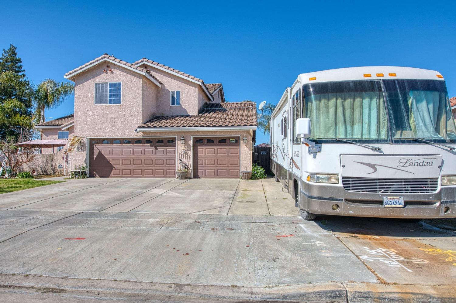 901 Maple Street Parlier, CA 93648 - Photo 63 of 67 a front view of a house with a garden