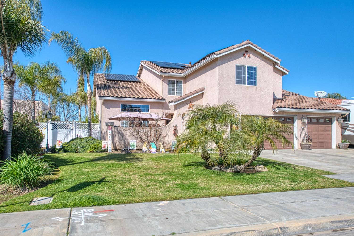 901 Maple Street Parlier, CA 93648 - Photo 64 of 67 a view of a house with a yard