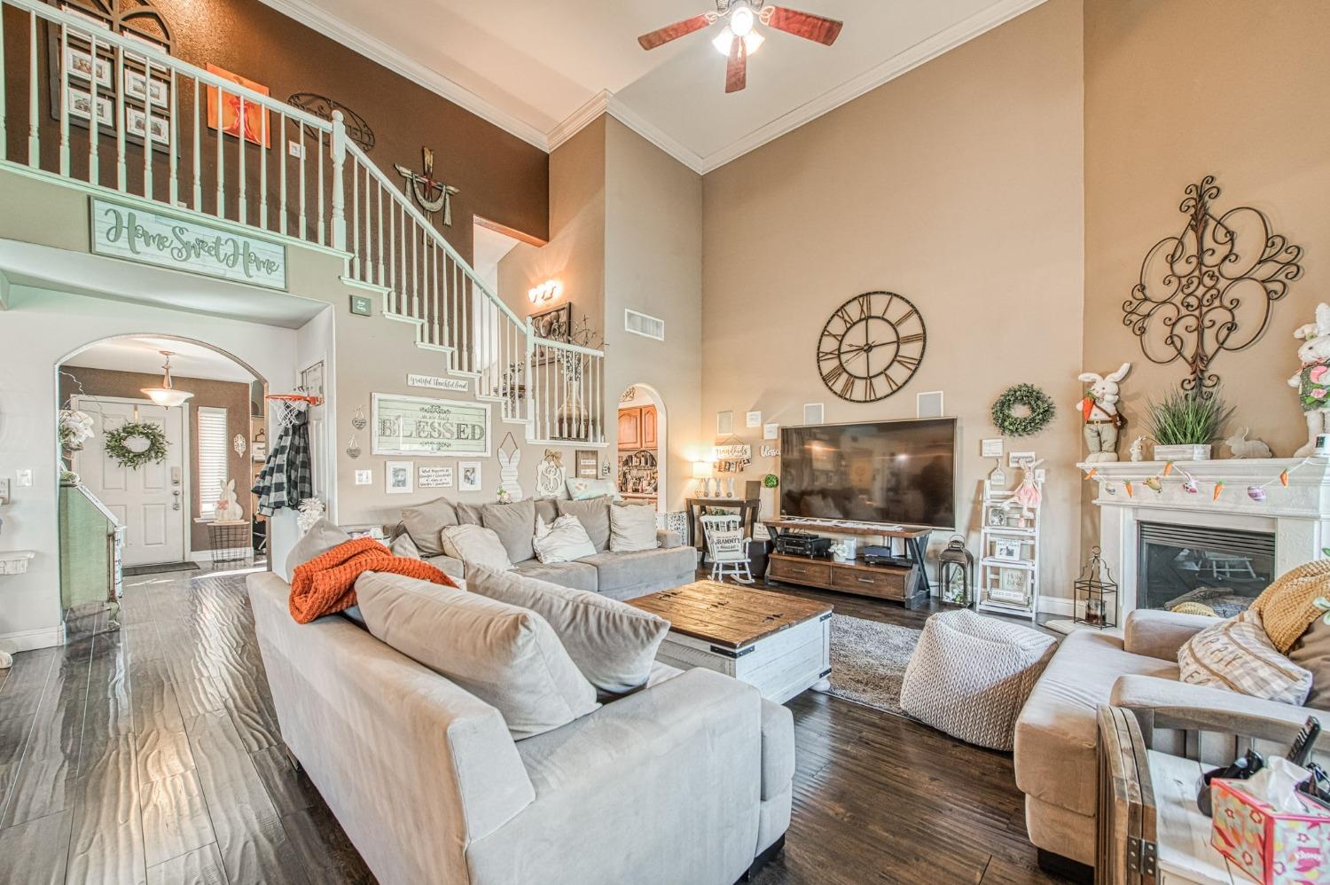 901 Maple Street Parlier, CA 93648 - Photo 9 of 67 a living room with fireplace furniture and a fireplace