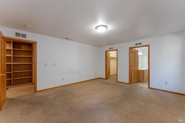 an empty room with a empty space and window