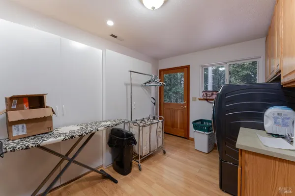 a bedroom with a bed and a potted plant