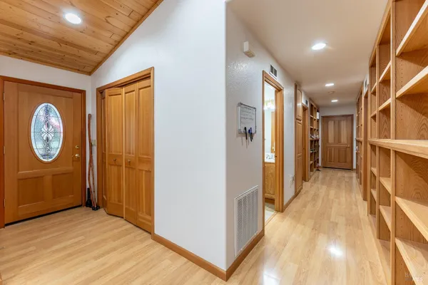 a view of entryway with wooden floor