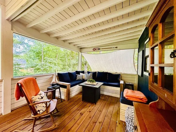 a view of a patio with table and chairs