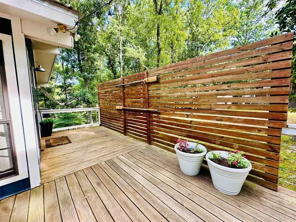 a view of a patio with couches and potted plants
