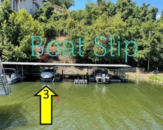 a backyard of a house with yard table and chairs