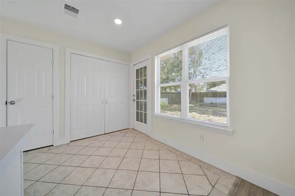 a view of an empty room with a window