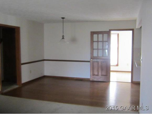 753 Ladd Road Fishersville, VA 22939 - Photo 2 of 25 a view of empty room with wooden floor and fan