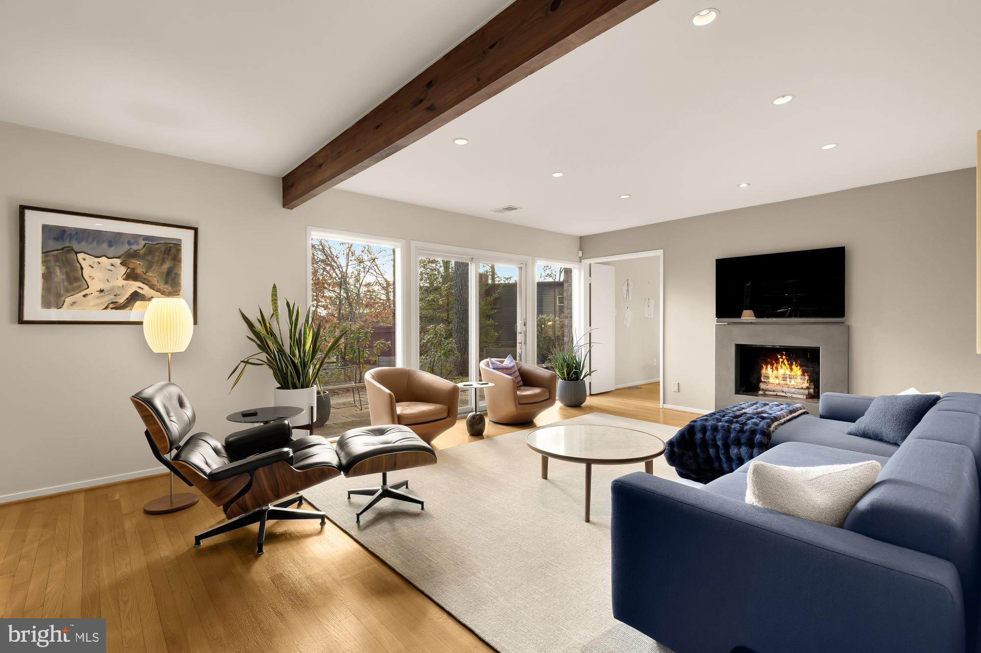5420 Mohican Road Bethesda, MD 20816 - Photo 12 of 71 a living room with furniture floor to ceiling window and a flat screen tv