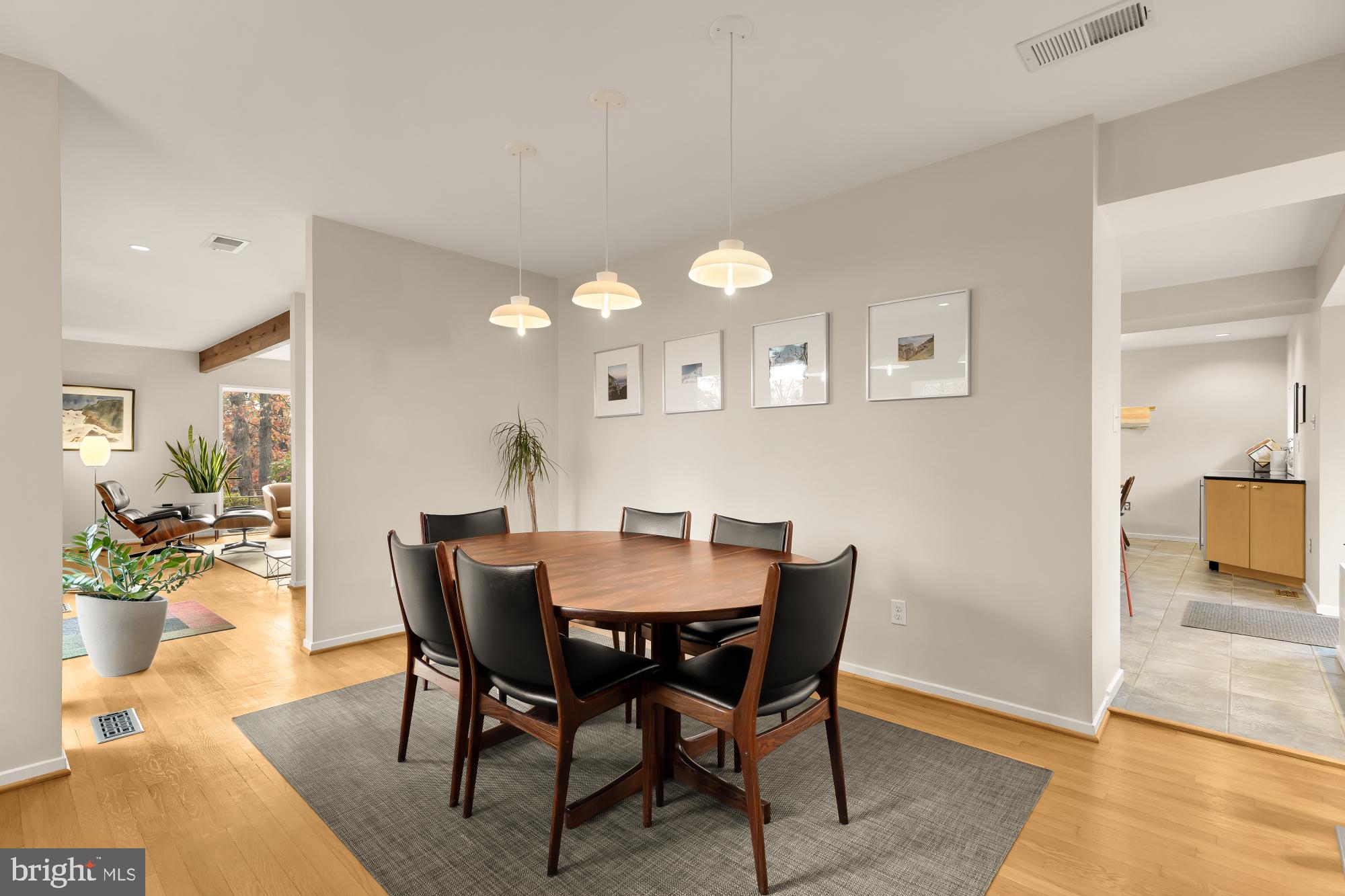 5420 Mohican Road Bethesda, MD 20816 - Photo 15 of 71 a view of a dining room with furniture and wooden floor