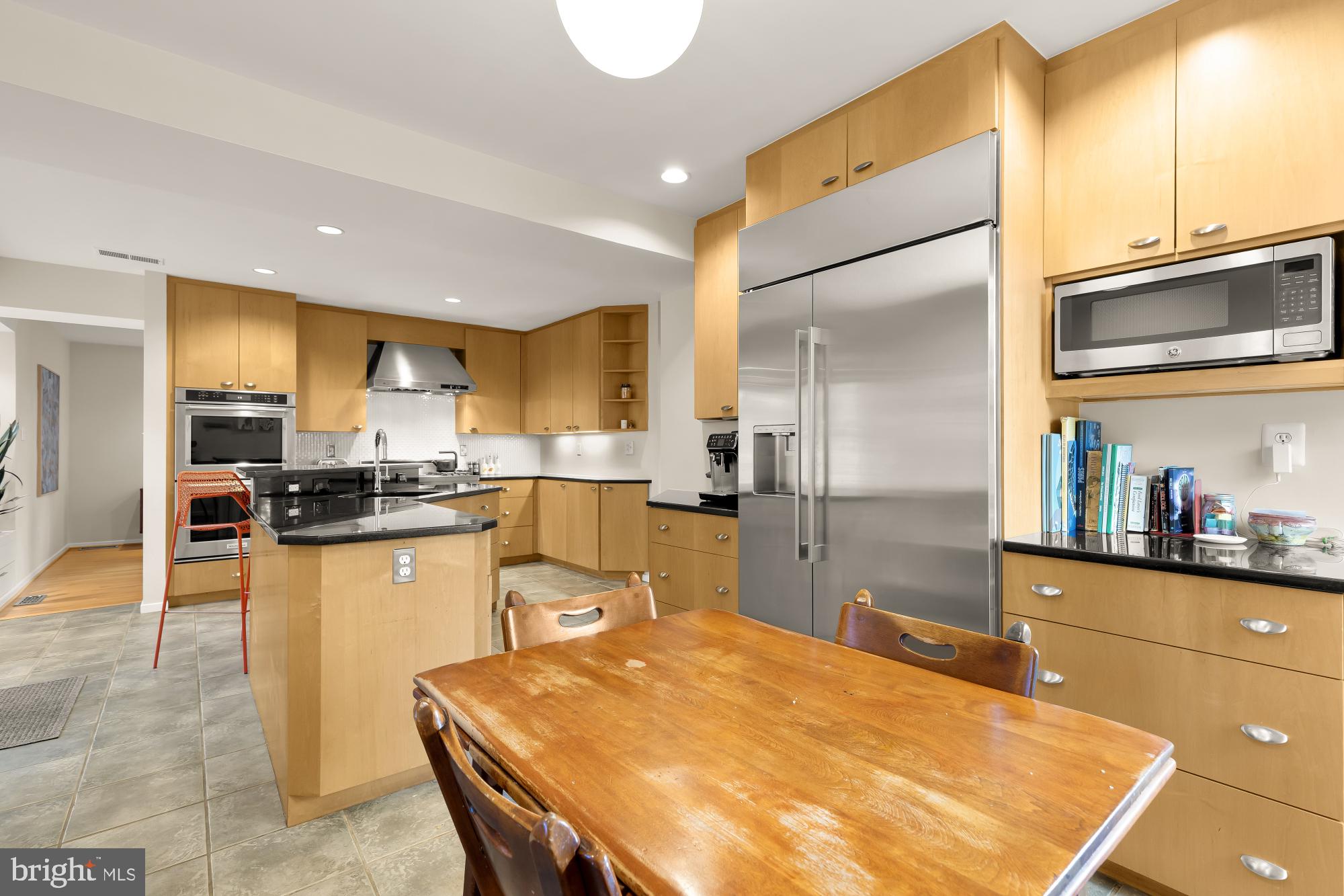 5420 Mohican Road Bethesda, MD 20816 - Photo 19 of 71 a kitchen with stainless steel appliances kitchen island granite countertop a sink and cabinets