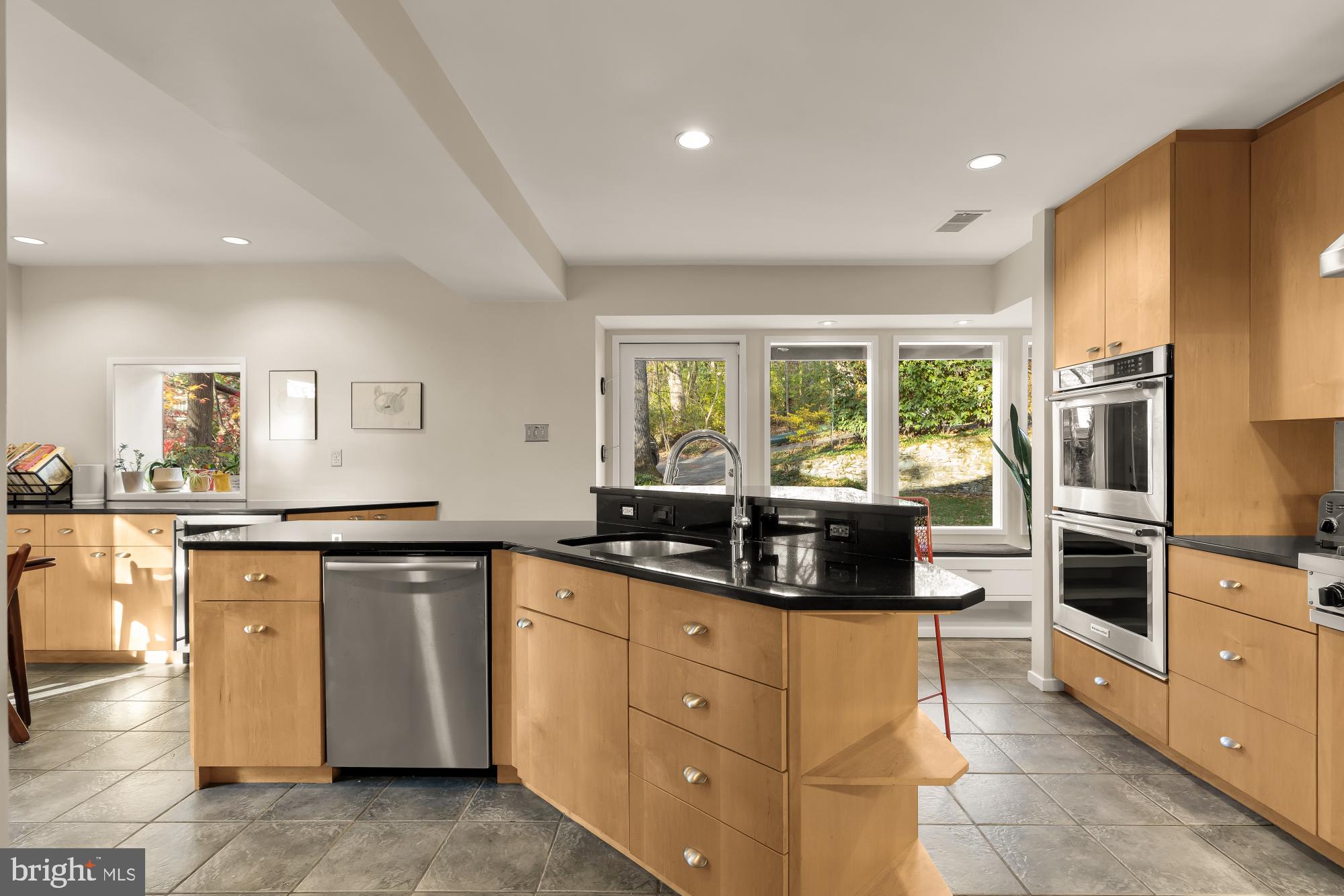 5420 Mohican Road Bethesda, MD 20816 - Photo 24 of 71 a kitchen with white cabinets and appliances