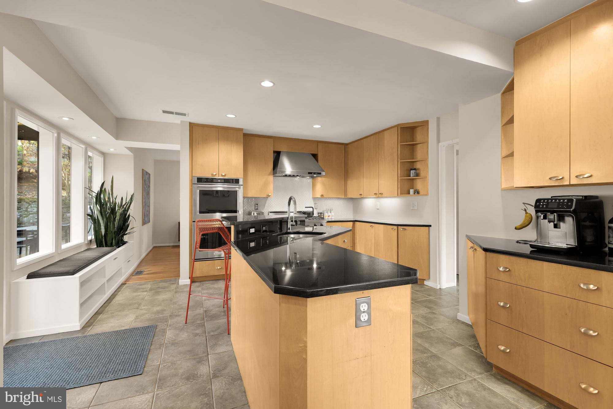 5420 Mohican Road Bethesda, MD 20816 - Photo 25 of 71 a kitchen with granite countertop a sink a counter top space and stainless steel appliances