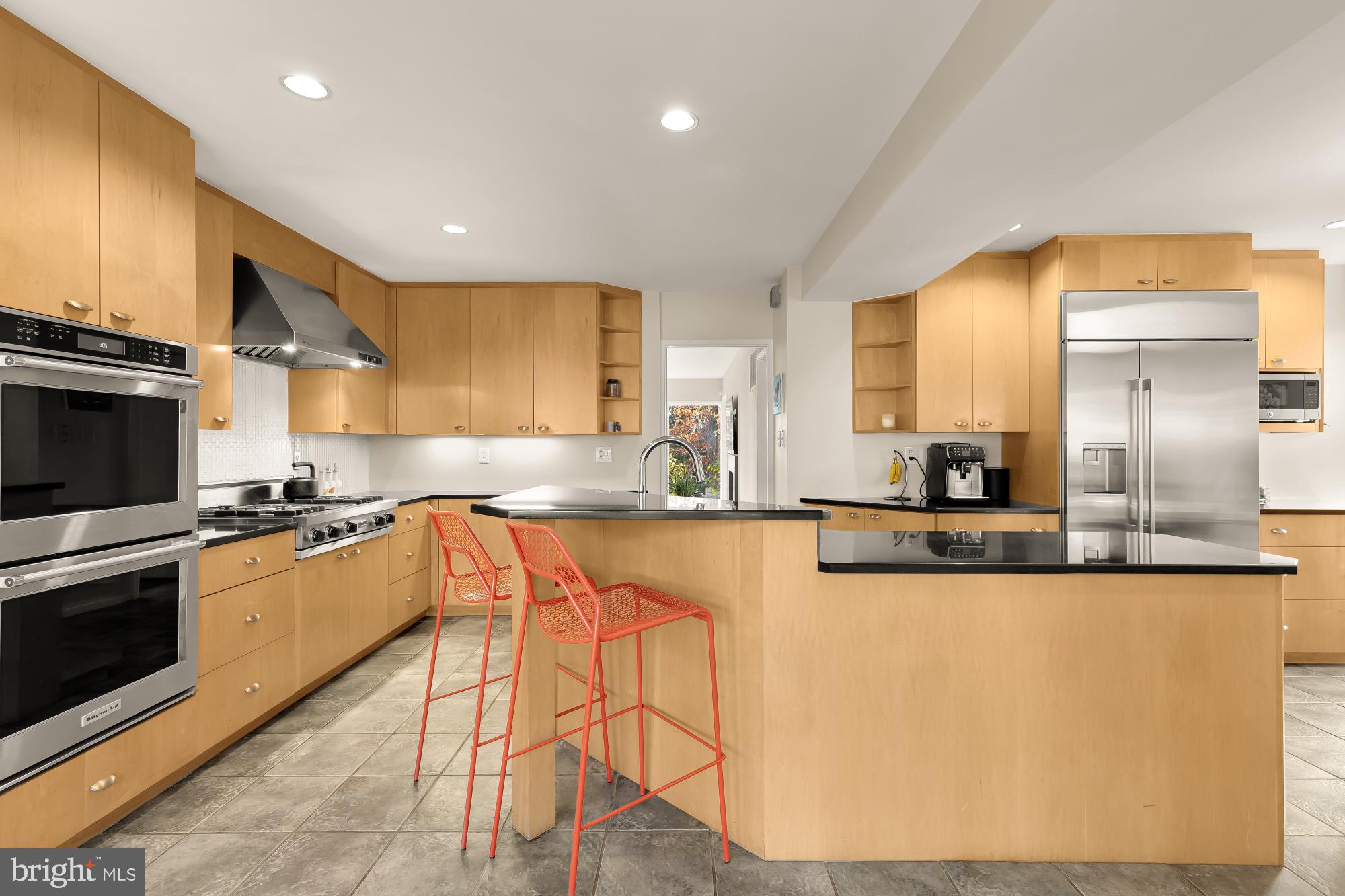 5420 Mohican Road Bethesda, MD 20816 - Photo 26 of 71 a large kitchen with granite countertop lots of counter top space and stainless steel appliances