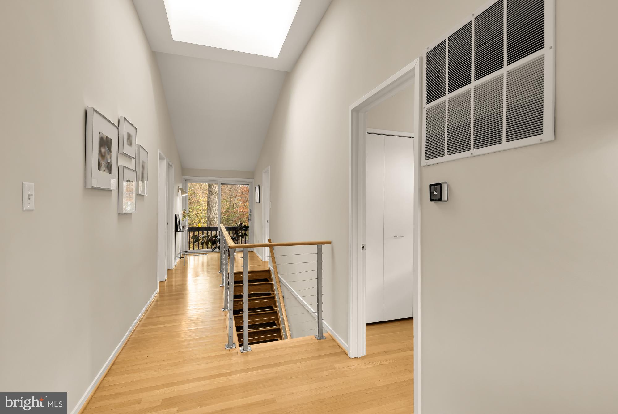 5420 Mohican Road Bethesda, MD 20816 - Photo 31 of 71 a view of a hallway with wooden floor and staircase