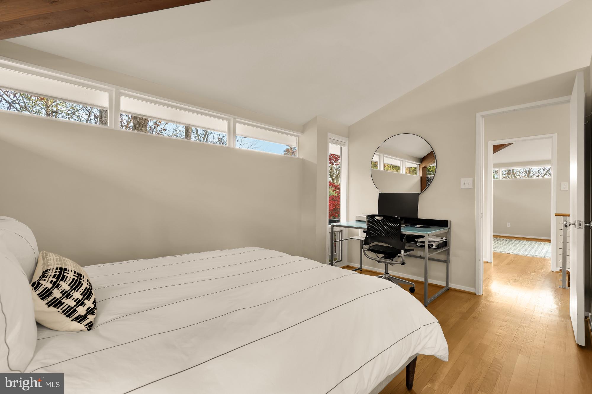 5420 Mohican Road Bethesda, MD 20816 - Photo 34 of 71 a bedroom with a bed and dresser with mirror
