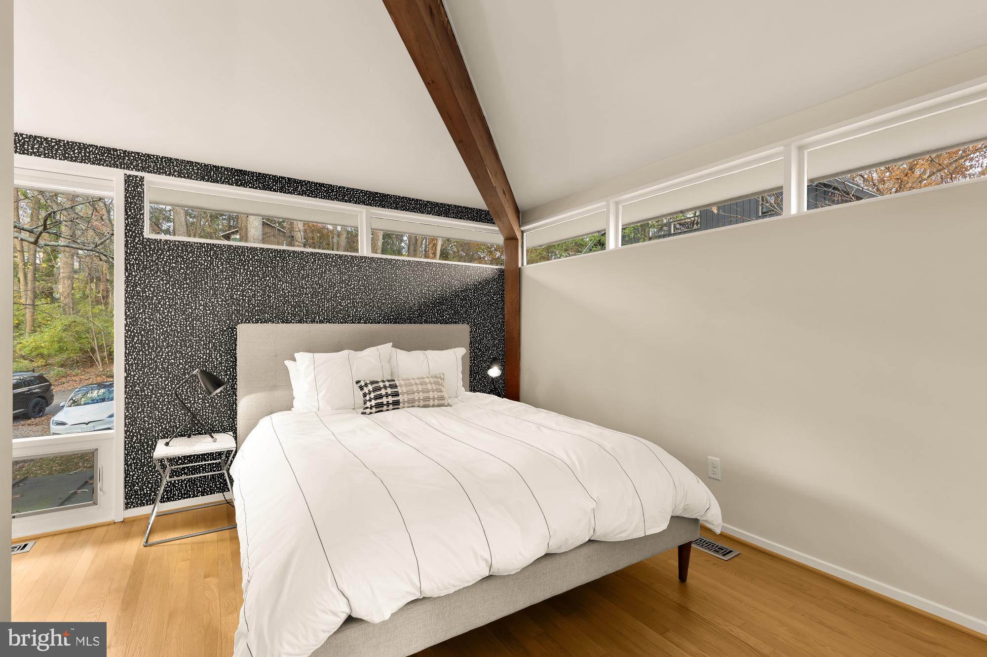 5420 Mohican Road Bethesda, MD 20816 - Photo 35 of 71 a bedroom with a bed and wooden floor