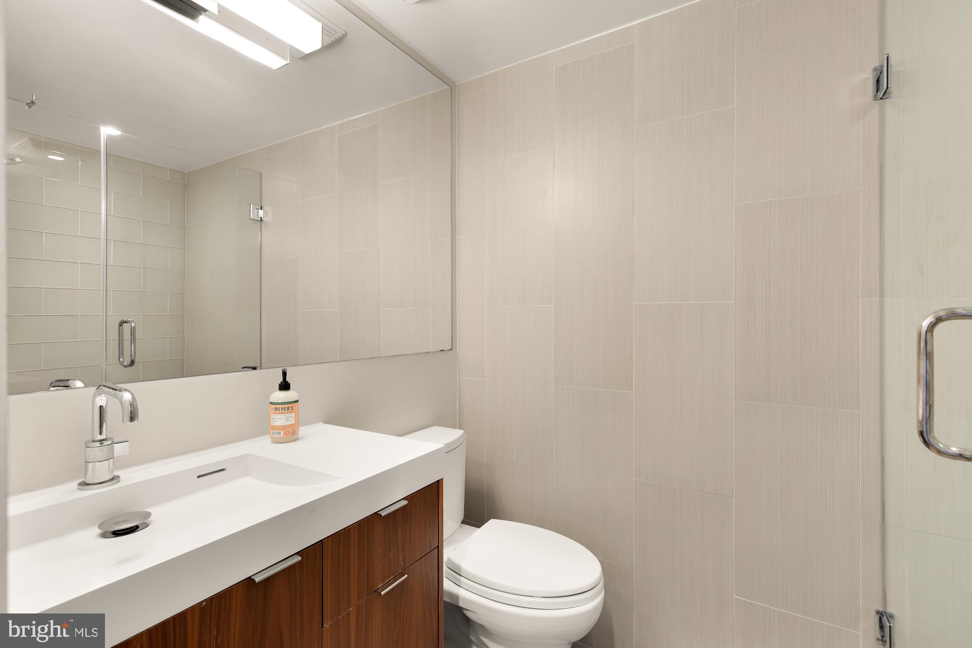 5420 Mohican Road Bethesda, MD 20816 - Photo 39 of 71 a bathroom with a sink a toilet and shower