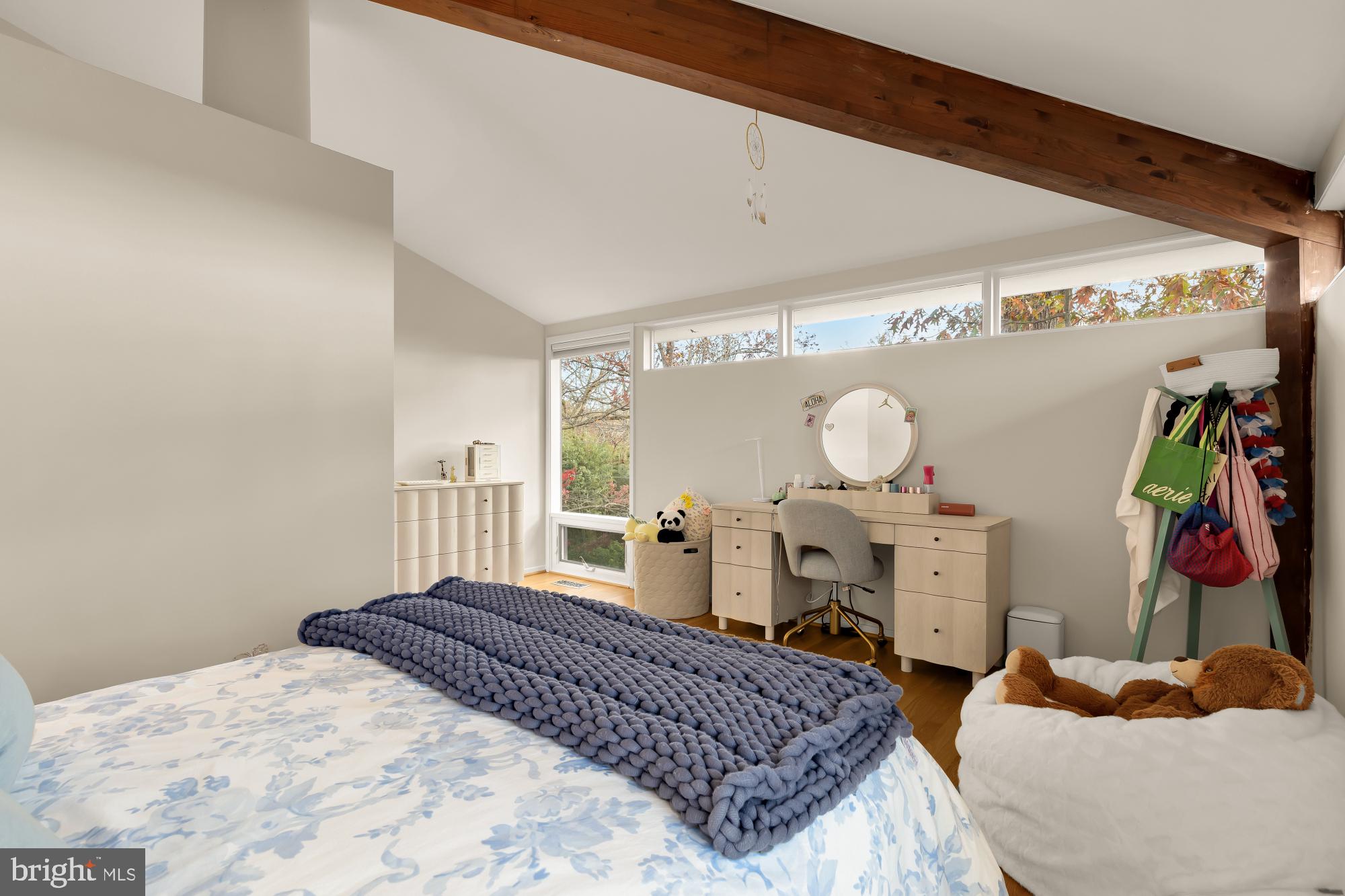 5420 Mohican Road Bethesda, MD 20816 - Photo 43 of 71 a bedroom with a bed and dresser with mirror