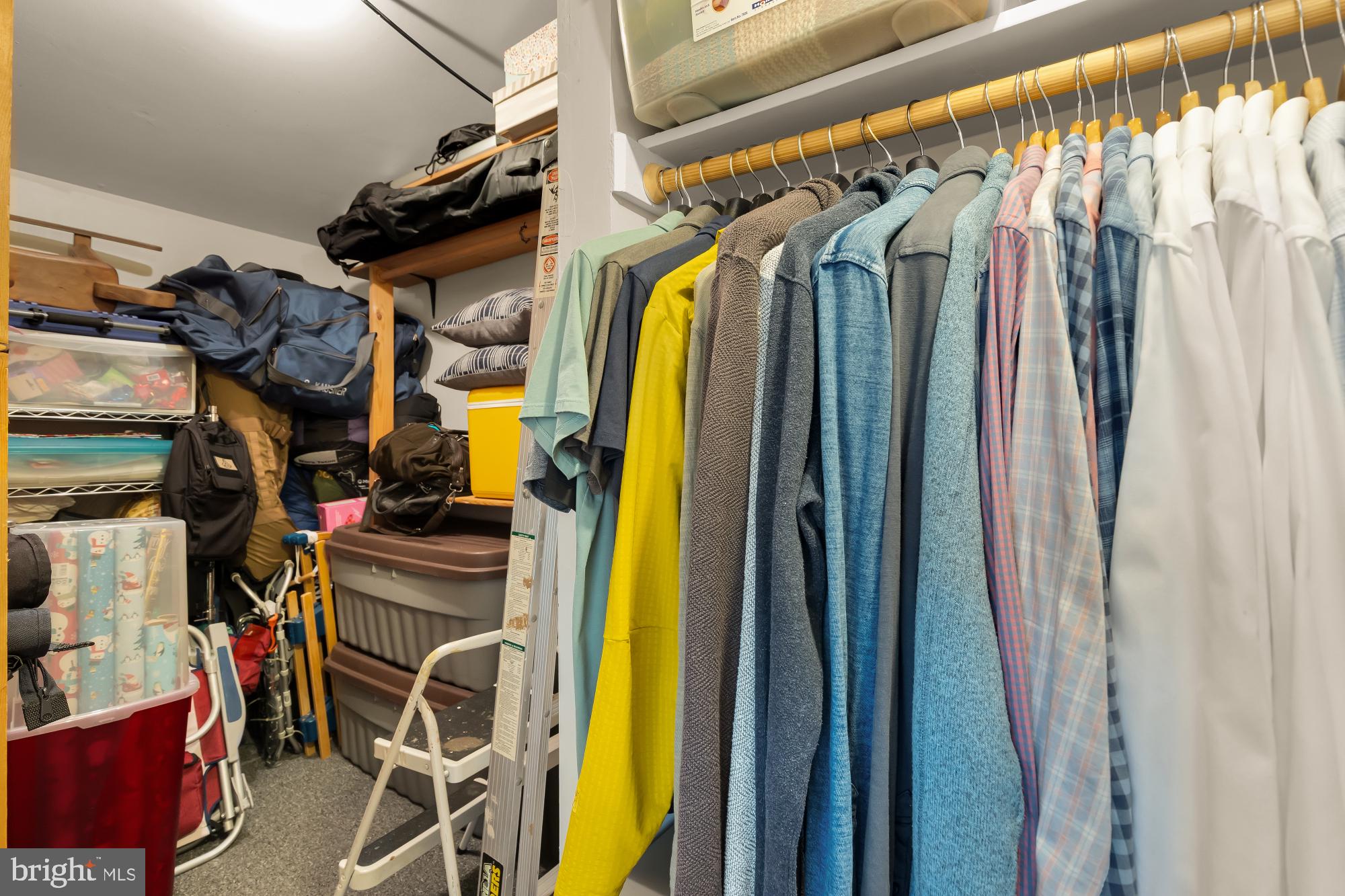 5420 Mohican Road Bethesda, MD 20816 - Photo 47 of 71 a view of walk in closet with clothes and shoes