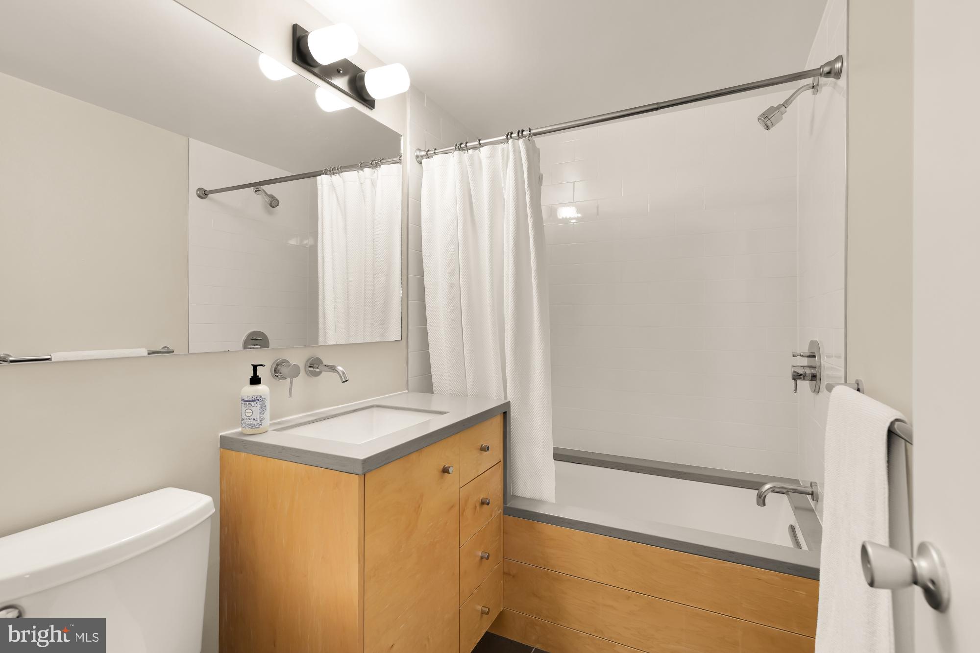 5420 Mohican Road Bethesda, MD 20816 - Photo 51 of 71 a bathroom with a sink and a mirror