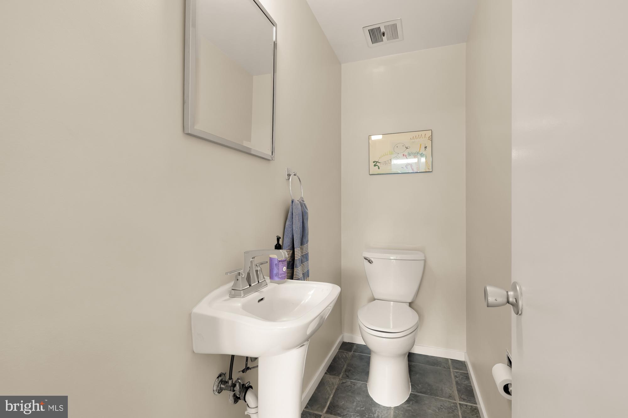 5420 Mohican Road Bethesda, MD 20816 - Photo 54 of 71 a bathroom with a toilet a sink and mirror