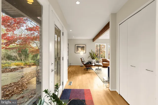 a living room with furniture fireplace and a flat screen tv