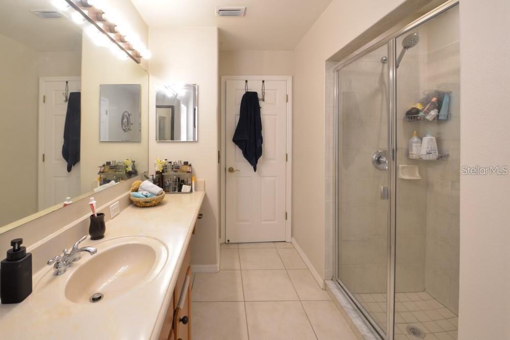 11347 Walden Loop Parrish, FL 34219 - Photo 15 of 29 a bathroom with a sink a toilet and shower