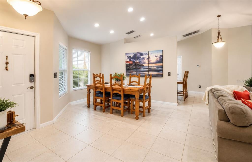 11347 Walden Loop Parrish, FL 34219 - Photo 3 of 29 a view of a dining room with furniture