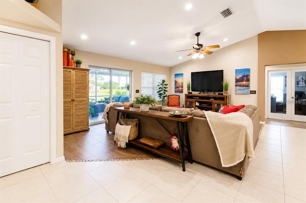11347 Walden Loop Parrish, FL 34219 - Photo 5 of 29 a living room with furniture and a flat screen tv