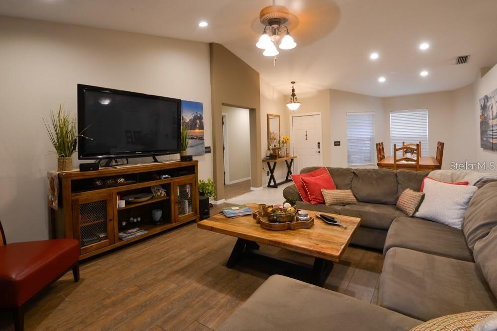 11347 Walden Loop Parrish, FL 34219 - Photo 10 of 29 a living room with furniture and a flat screen tv