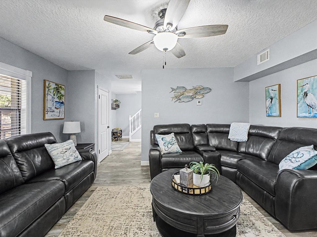 24420 Lanark Road Brooksville, FL 34601 - Photo 12 of 56 a living room with furniture and a couch