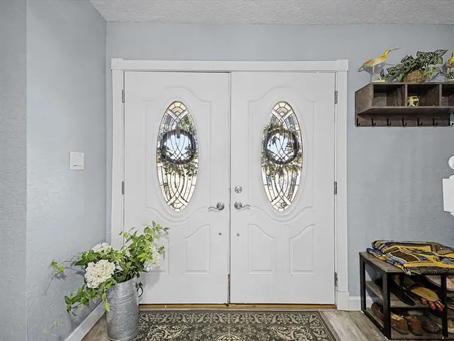 a view of two chairs in the balcony