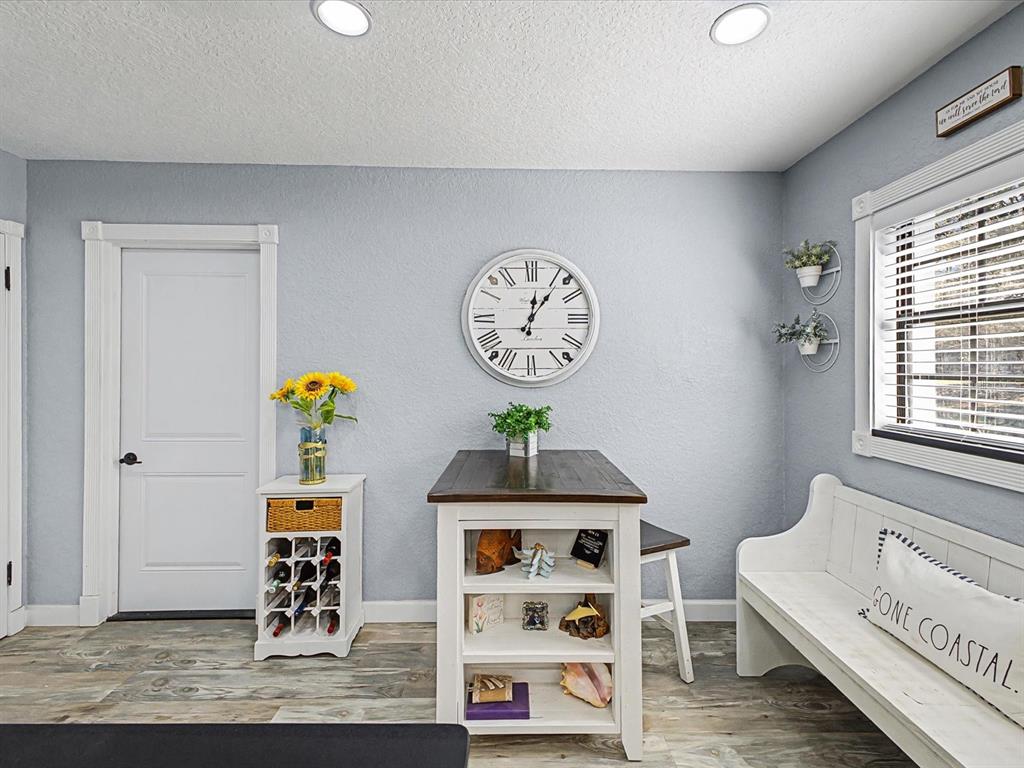 24420 Lanark Road Brooksville, FL 34601 - Photo 9 of 56 a view of dining room and wooden floor