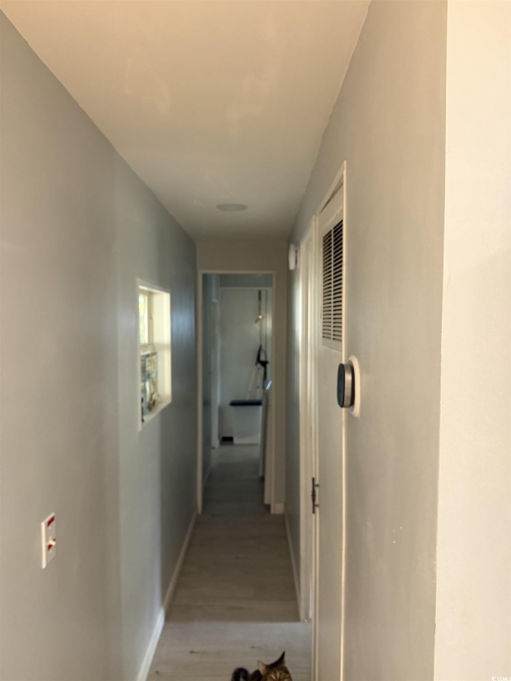 2945 Clemson Trail Murrells Inlet, SC 29576 - Photo 14 of 23 Corridor featuring baseboards and light wood-type flooring