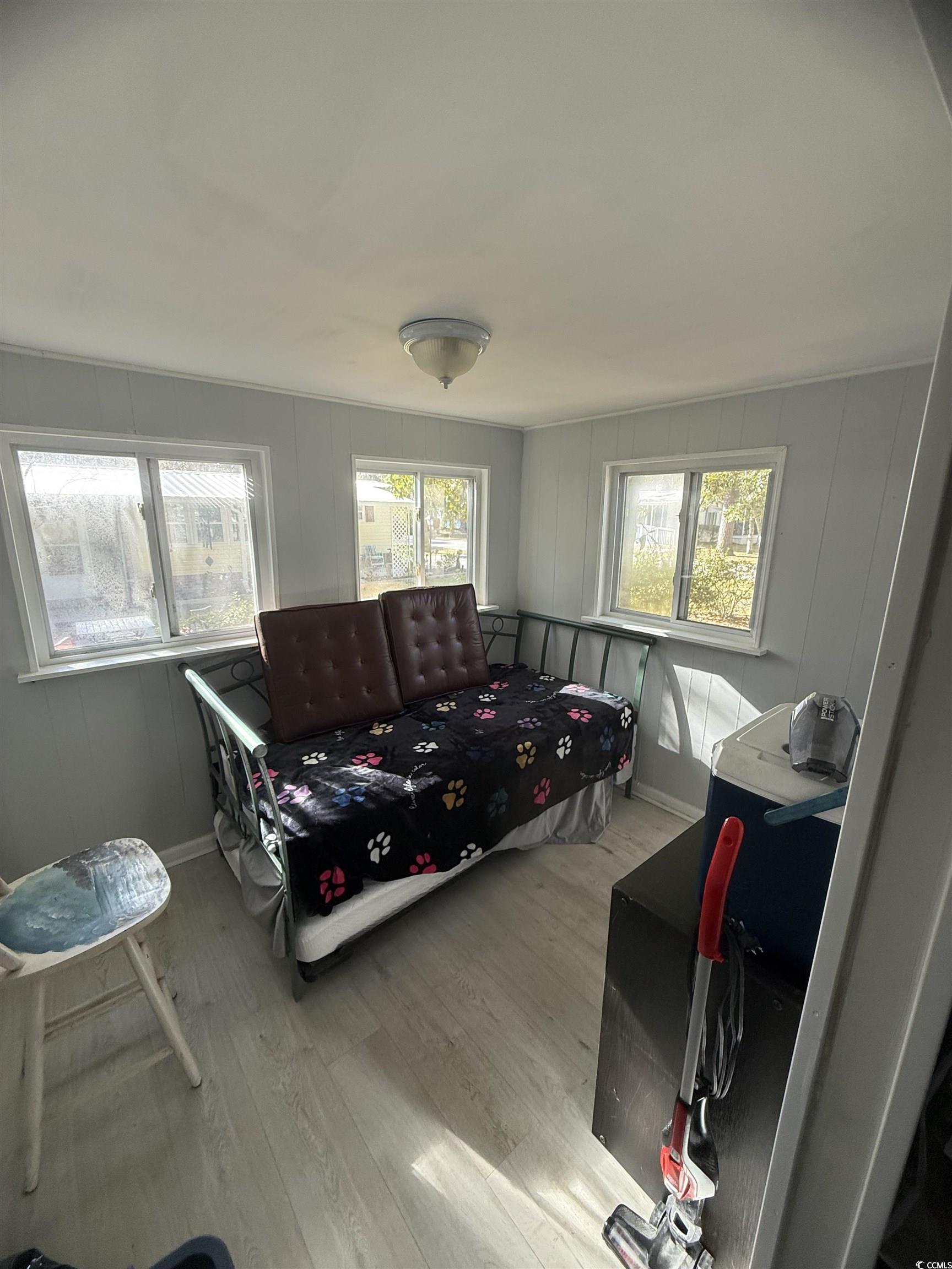 2945 Clemson Trail Murrells Inlet, SC 29576 - Photo 16 of 23 Living room featuring wood finished floors and baseboards