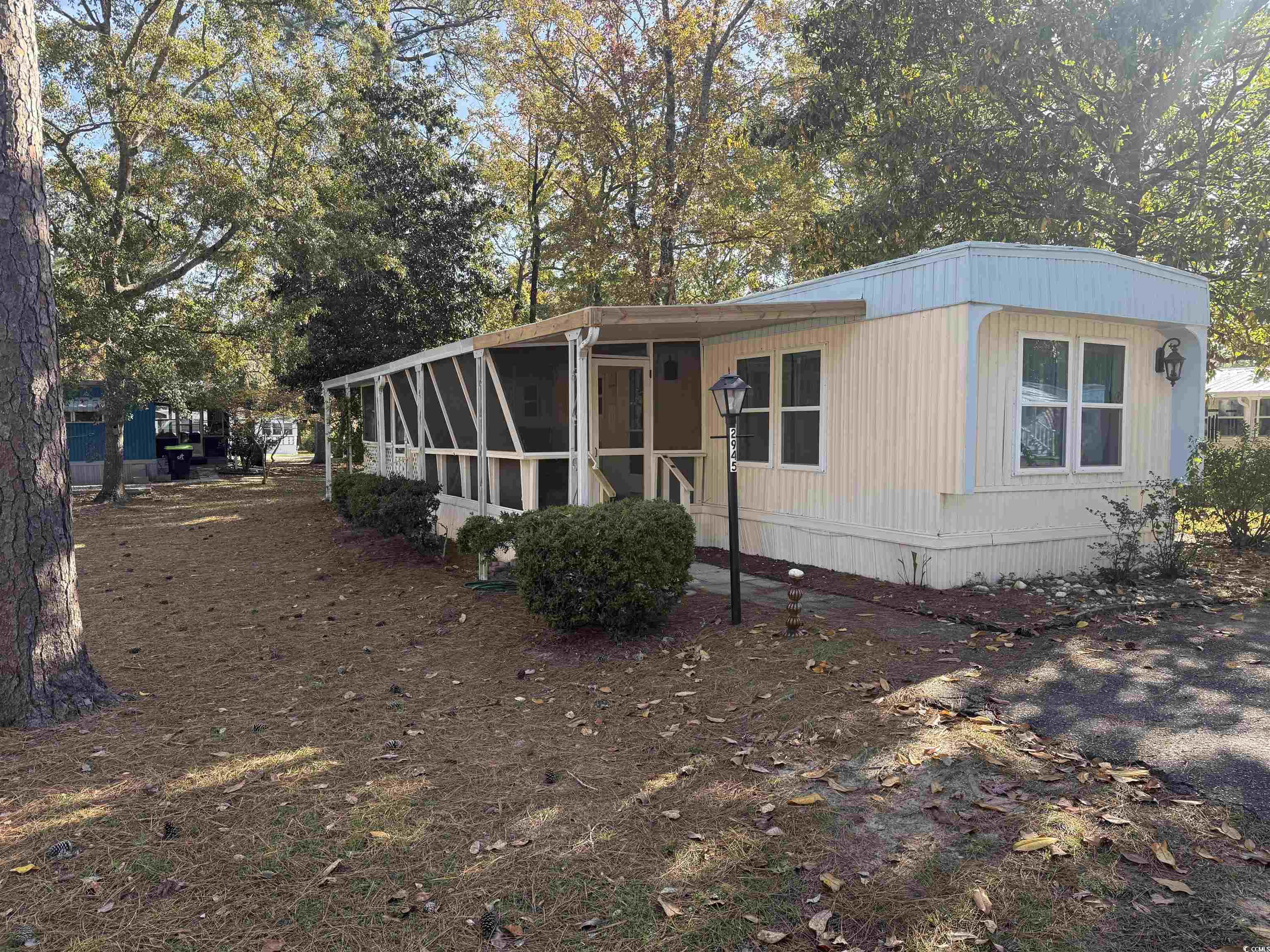 2945 Clemson Trail Murrells Inlet, SC 29576 - Photo 3 of 23 View of side of property with a sunroom