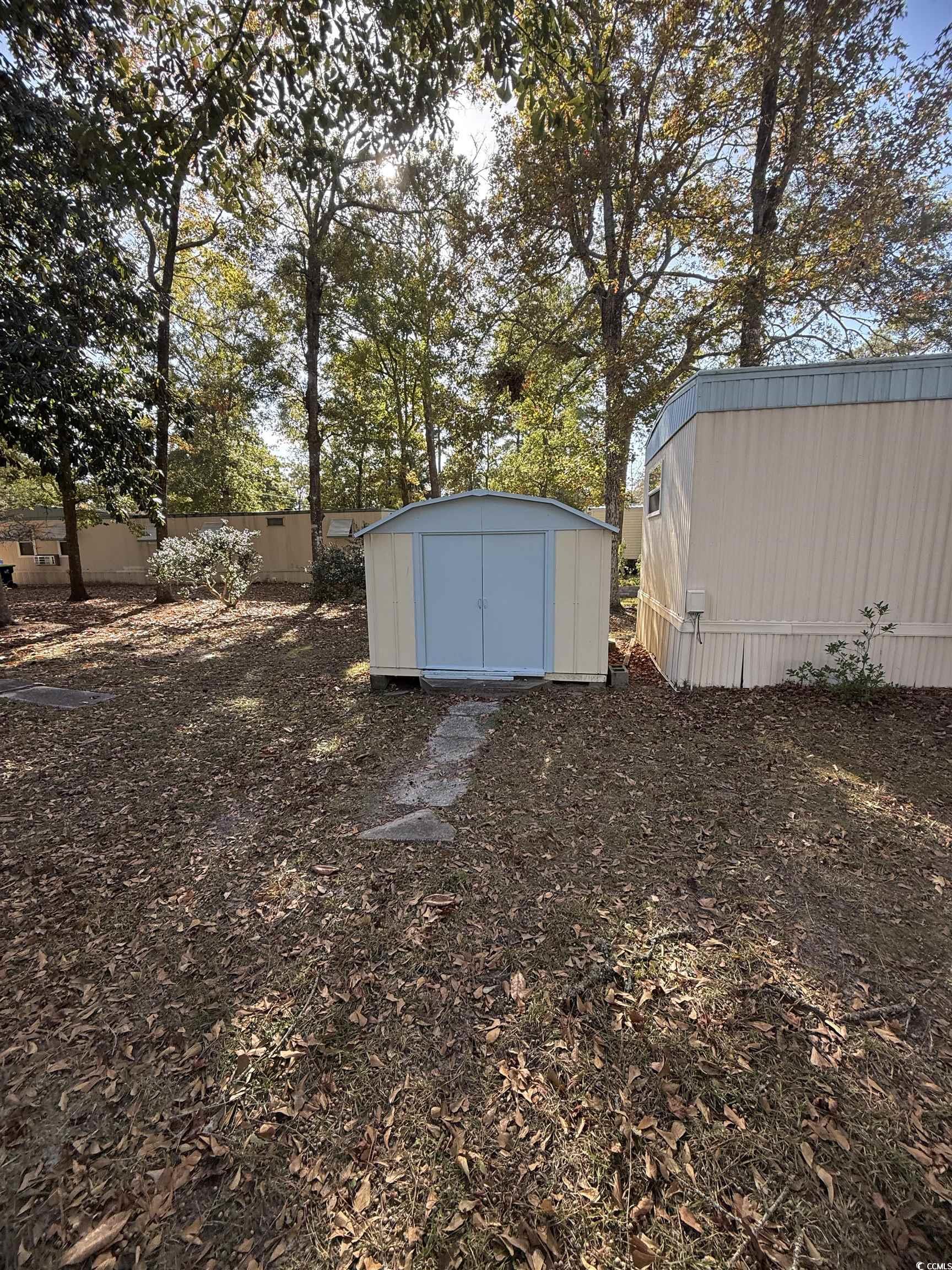 2945 Clemson Trail Murrells Inlet, SC 29576 - Photo 5 of 23 View of yard featuring a storage unit
