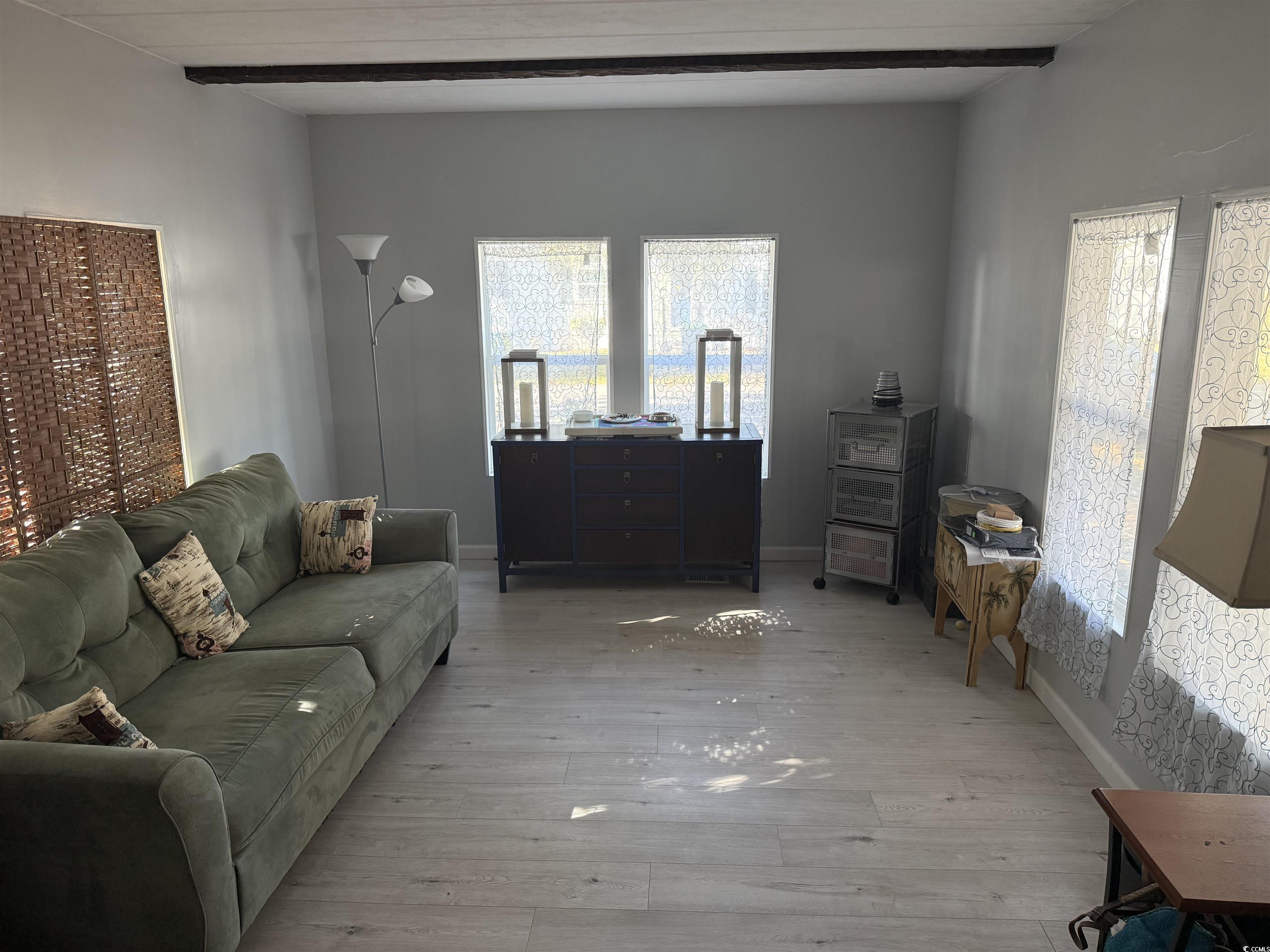 2945 Clemson Trail Murrells Inlet, SC 29576 - Photo 8 of 23 Living room featuring hardwood / wood-style flooring and beamed ceiling