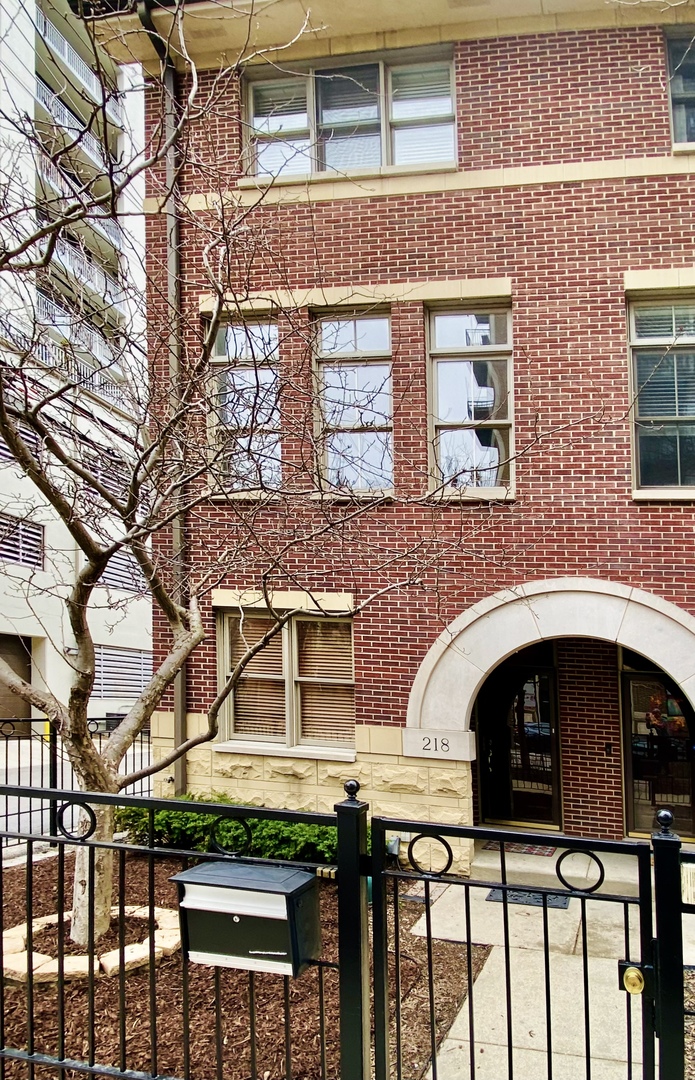 218 East Cullerton Street Chicago, IL 60616 - Photo 1 of 29 a front view of a building with glass windows
