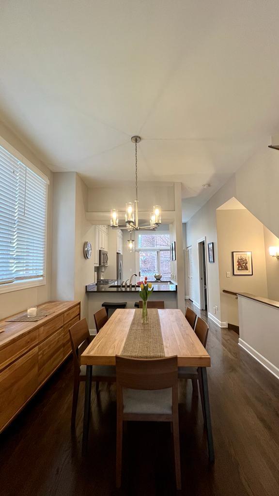 218 East Cullerton Street Chicago, IL 60616 - Photo 12 of 29 a kitchen with a table chairs stove and cabinets
