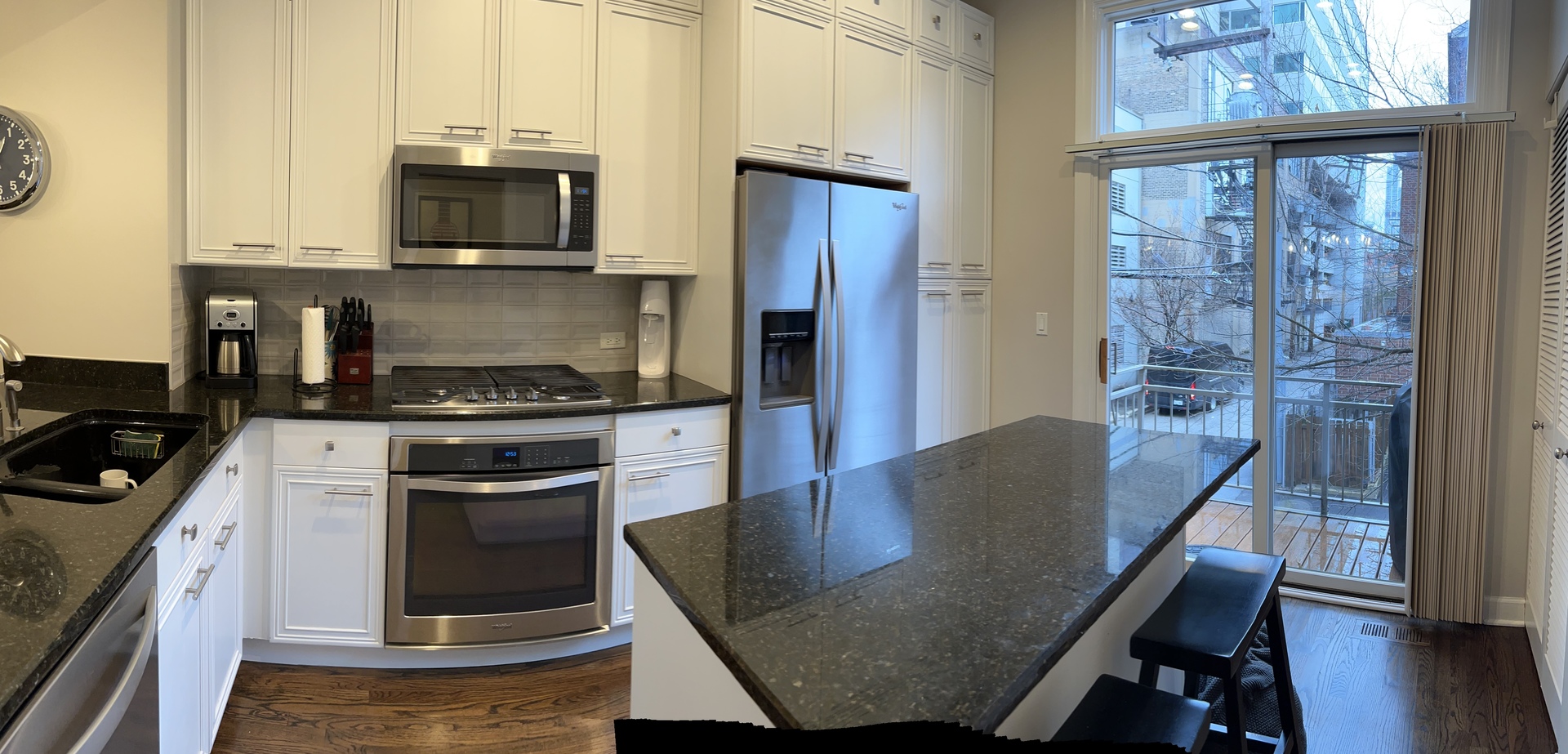 218 East Cullerton Street Chicago, IL 60616 - Photo 14 of 29 a kitchen with stainless steel appliances granite countertop a stove a microwave a sink and cabinets