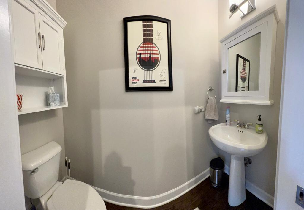 218 East Cullerton Street Chicago, IL 60616 - Photo 16 of 29 a bathroom with a toilet a sink and mirror