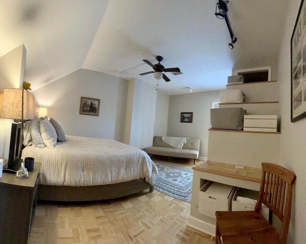 218 East Cullerton Street Chicago, IL 60616 - Photo 26 of 29 a bedroom with a bed and a chair