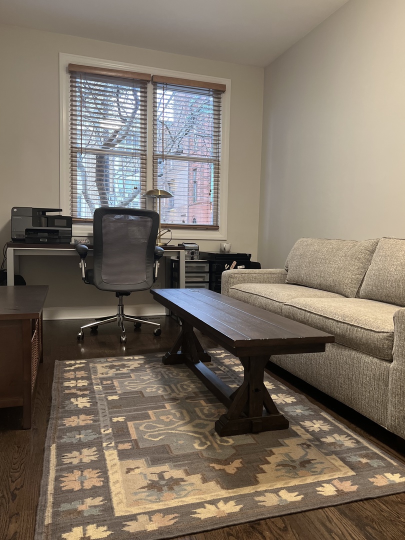 218 East Cullerton Street Chicago, IL 60616 - Photo 5 of 29 a living room with a couch coffee table and a piano table